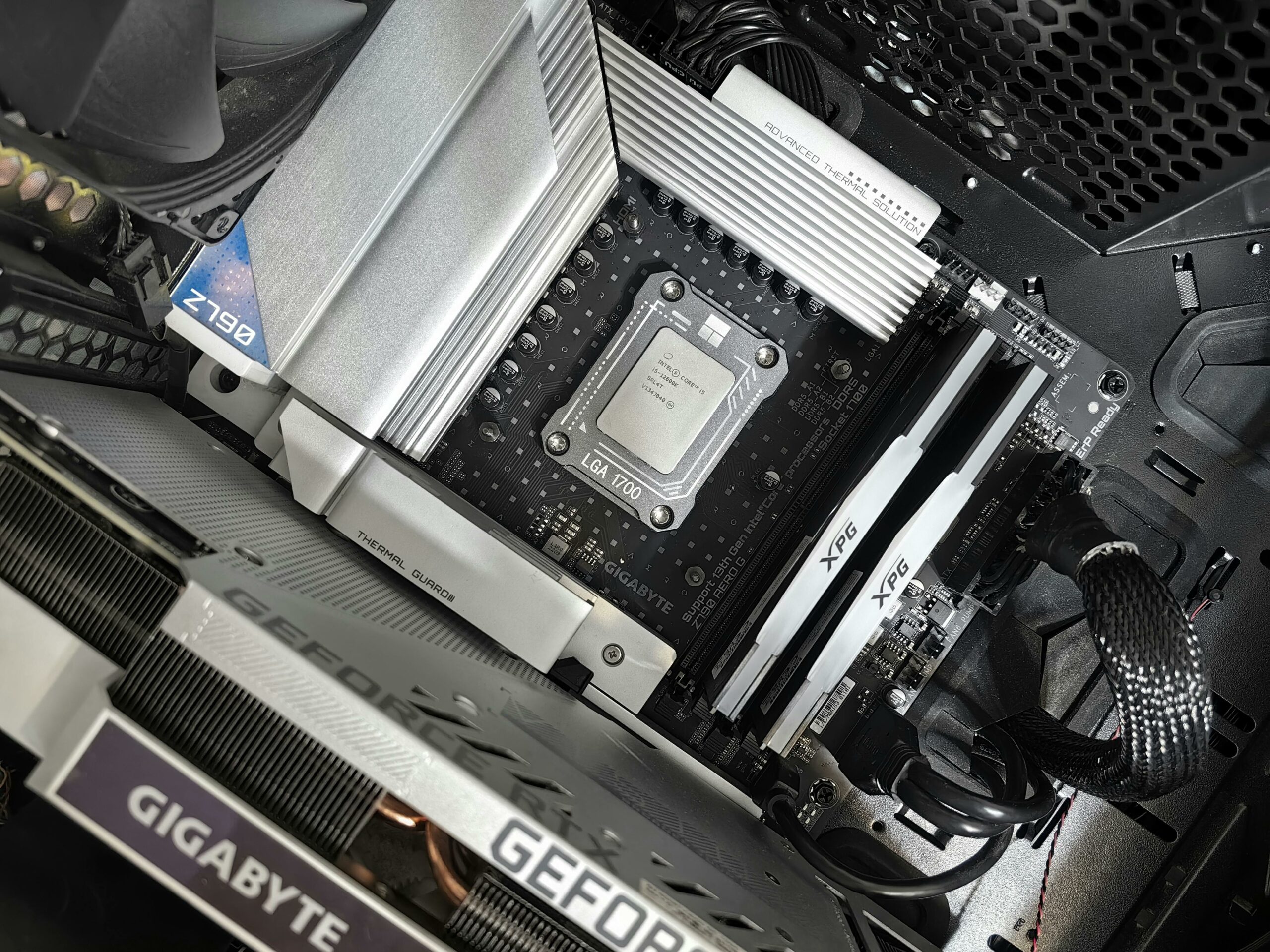 Interior view of a high-performance PC build featuring a Gigabyte motherboard and components.